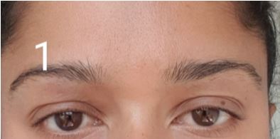 How to shape your eyebrows - clean the brow area.