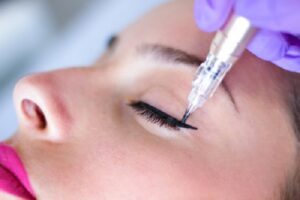 Woman having semi permanent eyebrow treatment